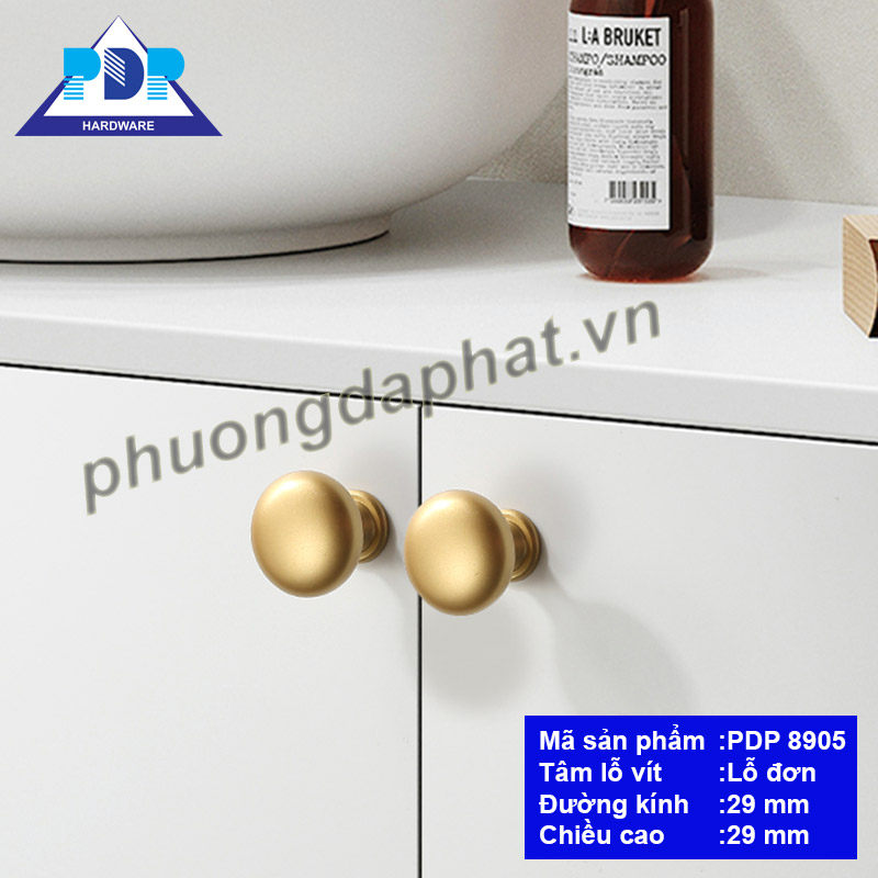 Núm Tay Nắm Tủ với mặt tròn nhẵn và màu vàng mờ tạo hiệu ứng bắt mắt