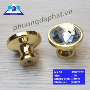 Núm Tay Nắm Tủ hiện đại với màu vàng bóng được đính một viên đá mô phỏng kim cương ngay trung tâm tay tủ