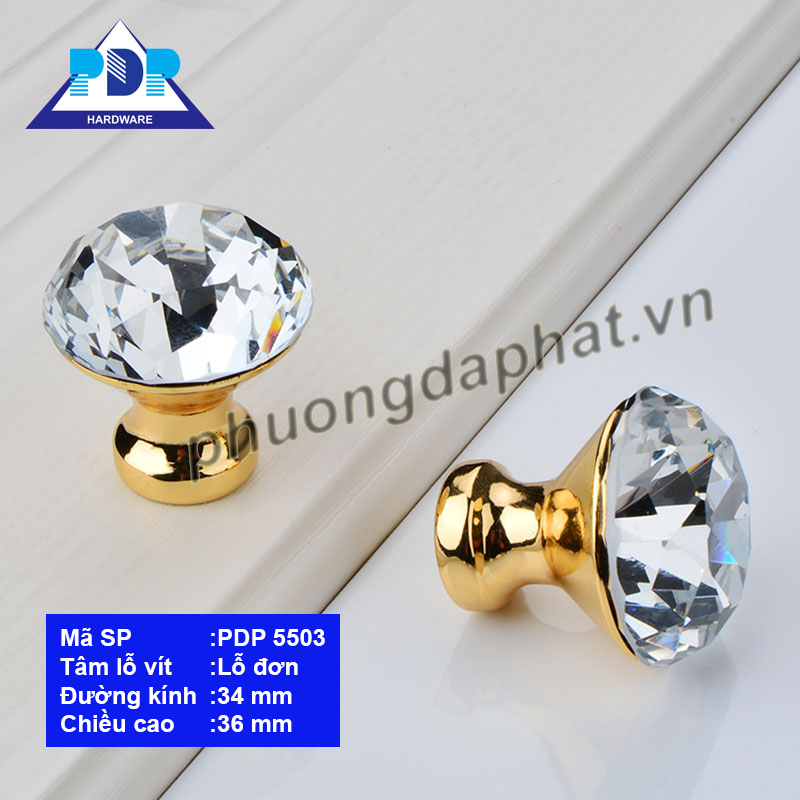 Núm Tủ hiện đại với màu vàng bóng được đính một viên đá mô phỏng kim cương ngay trung tâm tay tủ